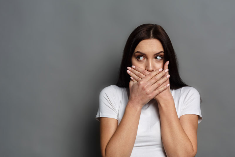 Dental Patient Hiding Her Mouth