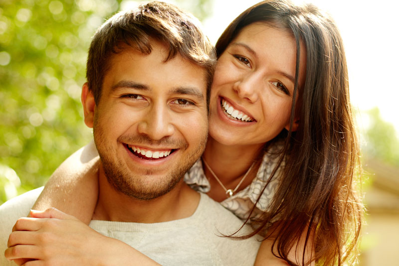 Two Dental Implant Patients Smiling Together