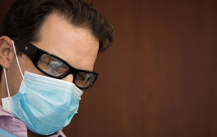 Dr Howard Wearing a Mask.webp